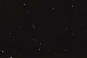 Галактика M98 в созвездии Волос Вероники. Заметно несколько более слабых галактик спутников.